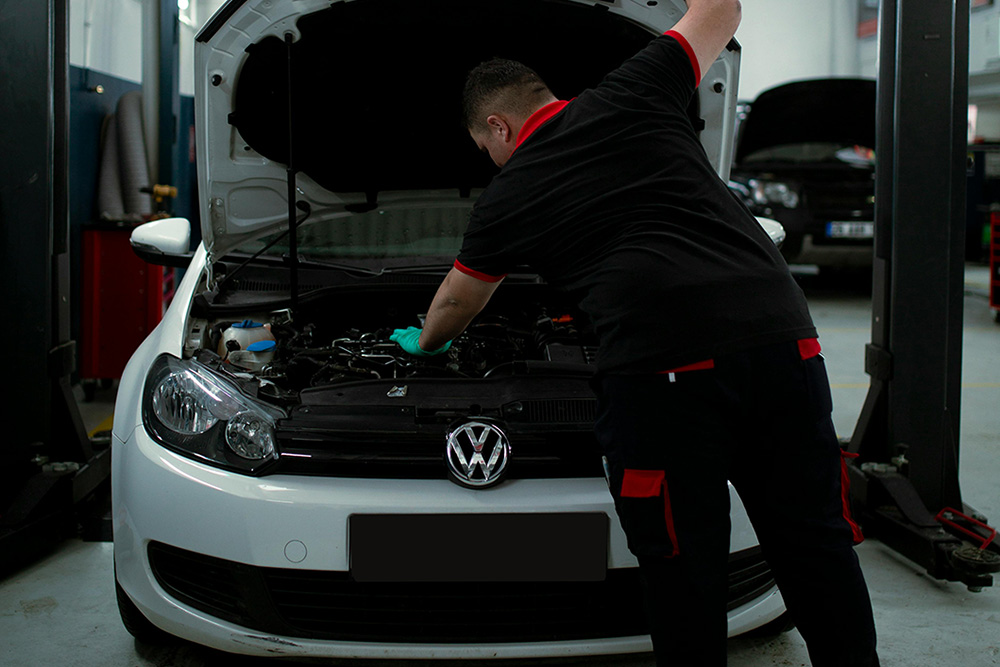 Mechanic servicing a Volkswagen